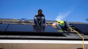 Two peoples adjusting the solar panels blog of Solar Supply Chain Expansion by sunteur renewables