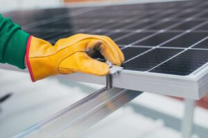 A hand holding a solar panel the blog of Solar Energy Solutions by sunteur renewables