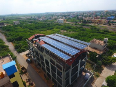 a building with solar panels in about us of sunteur renewables