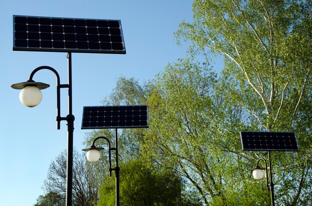 solar street light with panels close up against blue sky